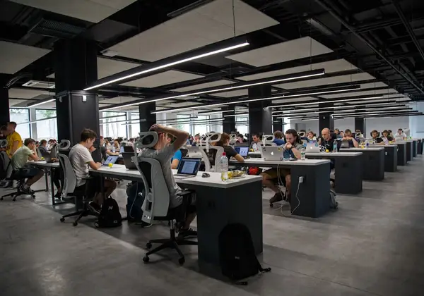 A wide view of a busy open-plan workspace
