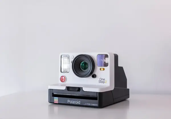 An instant camera on a white surface